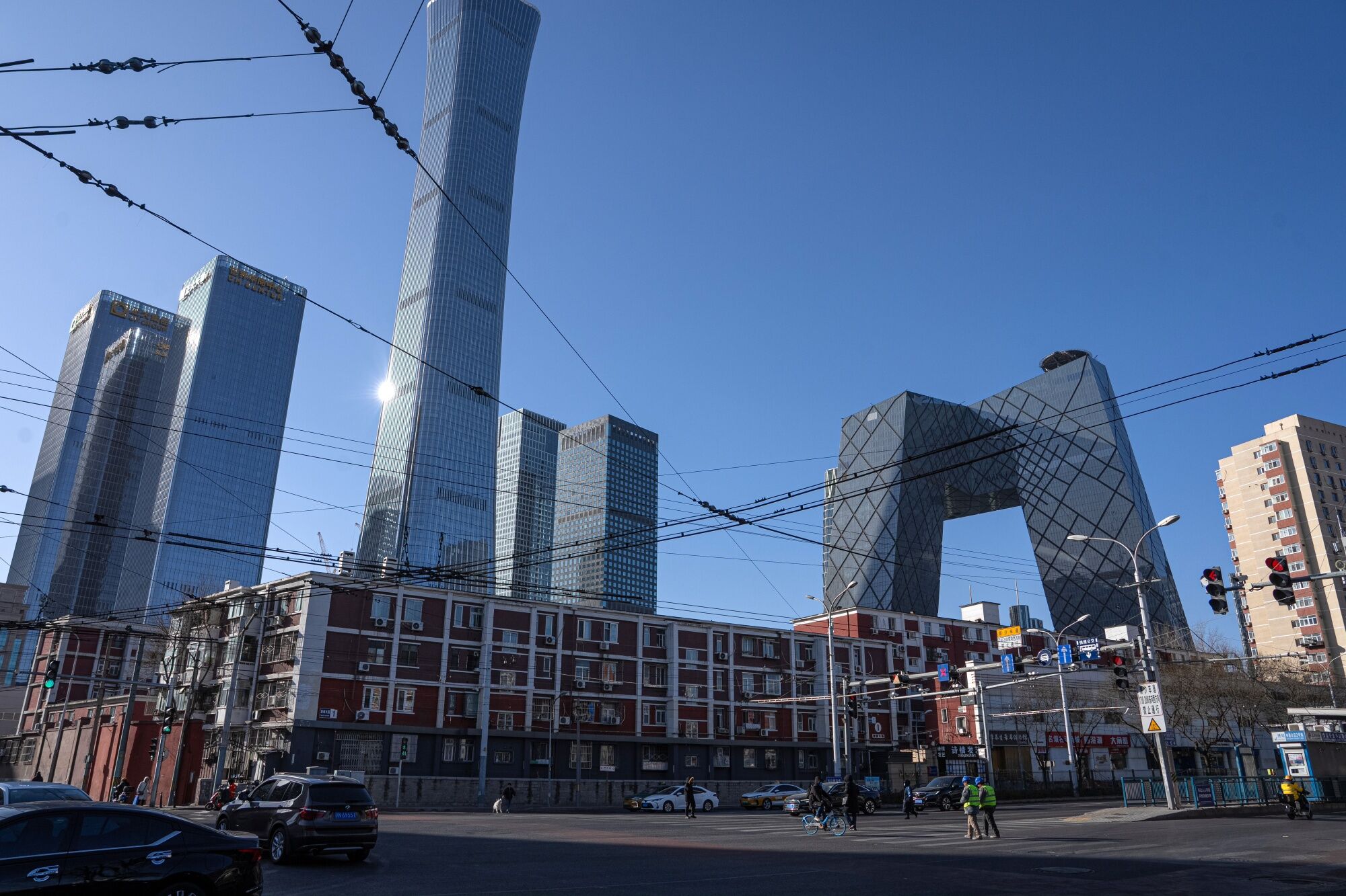 The CITIC Tower, fourth left, and the CCTV headquarters building, second right, among other buildings in Beijing, China, on Monday, Dec. 30, 2024. Chinese President Xi Jinping said the nation faces "very arduous" reform, development and stability tasks next year, after having “smoothly” achieved economic and social targets for 2024. Photographer: Na Bian/Bloomberg The CITIC Tower, fourth left, and the CCTV headquarters building, second right, among other buildings in Beijing, China, on Monday, Dec. 30, 2024. Chinese President Xi Jinping said the nation faces "very arduous" reform, development and stability tasks next year, after having “smoothly” achieved economic and social targets for 2024. Photographer: Na Bian/Bloomberg