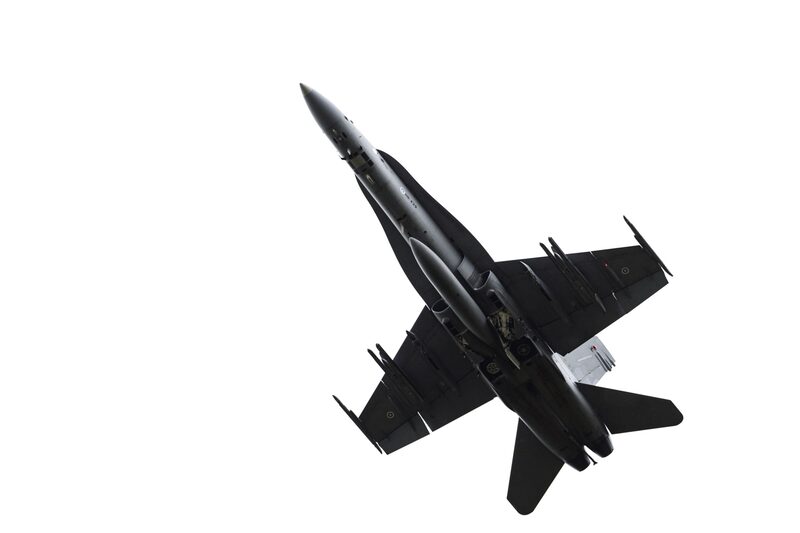 A Boeing F18 twin-engined multi-role fighter jet in the air. A Boeing F18 twin-engined multi-role fighter jet in the air.