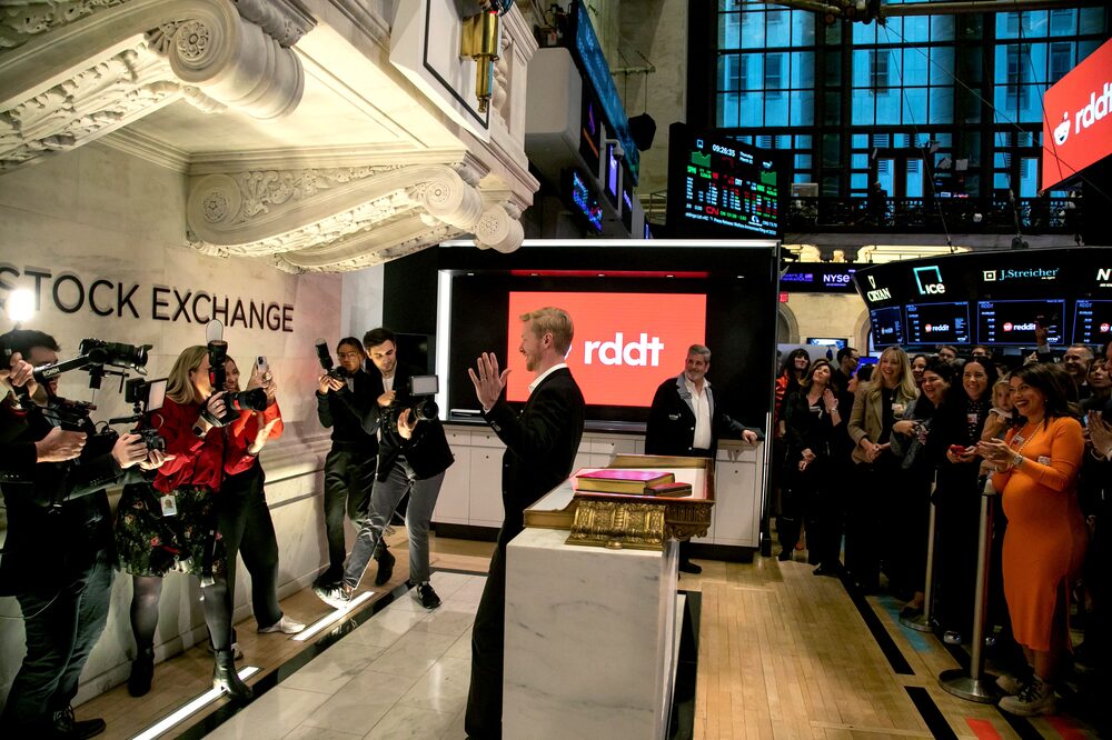 Steve Huffman, co-founder and chief executive officer of Reddit Inc., center, during the company's initial public offering (IPO) on the floor of the New York Stock Exchange (NYSE) in New York, US, on Thursday, March 21, 2024. Reddit Inc. and its selling shareholders raised $748 million, pricing shares in an initial public offering at the top of a marketed range, the second big tech listing in as many days. Photographer: Michael Nagle/Bloomberg Steve Huffman, co-founder and chief executive officer of Reddit Inc., center, during the company's initial public offering (IPO) on the floor of the New York Stock Exchange (NYSE) in New York, US, on Thursday, March 21, 2024. Reddit Inc. and its selling shareholders raised $748 million, pricing shares in an initial public offering at the top of a marketed range, the second big tech listing in as many days. Photographer: Michael Nagle/Bloomberg