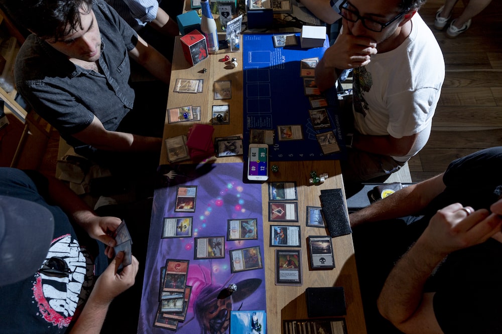 Participants play a Magic: The Gathering card game during a weekly tournament at the Uncommons hobby shop in New York, U.S., on Thursday, June 27, 2019. In the battle for gaming dominance, Hasbro Inc. has what it hopes is an ace up its sleevein a deck of playing cards that hit the market 26 years ago. Photographer: Mark Abramson/Bloomberg Participants play a Magic: The Gathering card game during a weekly tournament at the Uncommons hobby shop in New York, U.S., on Thursday, June 27, 2019. In the battle for gaming dominance, Hasbro Inc. has what it hopes is an ace up its sleevein a deck of playing cards that hit the market 26 years ago. Photographer: Mark Abramson/Bloomberg
