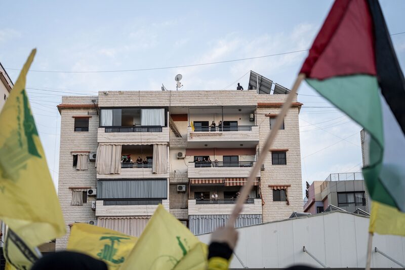 Supporters watch the broadcast of a speech by Hassan Nasrallah, leader of Hezbollah, from the balconies of a building in the Dahieh district of Beirut, Lebanon, on Friday, Nov. 3, 2023. The leader of Iran-backed Hezbollah warned all possibilities are open when it comes to the militant groups escalating attacks on Israel from Lebanon. Photographer: Francesca Volpi/Bloomberg Supporters watch the broadcast of a speech by Hassan Nasrallah, leader of Hezbollah, from the balconies of a building in the Dahieh district of Beirut, Lebanon, on Friday, Nov. 3, 2023. The leader of Iran-backed Hezbollah warned all possibilities are open when it comes to the militant groups escalating attacks on Israel from Lebanon. Photographer: Francesca Volpi/Bloomberg