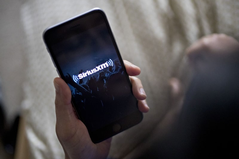 La aplicación Sirius XM Holdings Inc en un iPhone. La aplicación Sirius XM Holdings Inc en un iPhone.