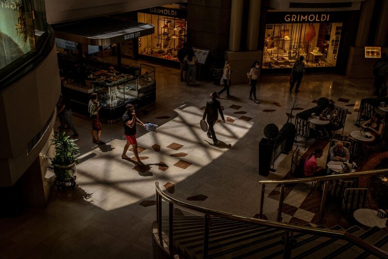 Shoppers walk through the Pacifico shopping mall in Buenos Aires. The government of President Alberto Fernández has struggled to convince travelers to put money into the country’s complex financial system. Shoppers walk through the Pacifico shopping mall in Buenos Aires. The government of President Alberto Fernández has struggled to convince travelers to put money into the country’s complex financial system.
