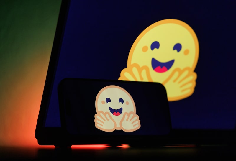 The logo of Hugging Face Inc. AI startup on a smartphone and laptop. Photographer: Andrey Rudakov/Bloomberg The logo of Hugging Face Inc. AI startup on a smartphone and laptop. Photographer: Andrey Rudakov/Bloomberg