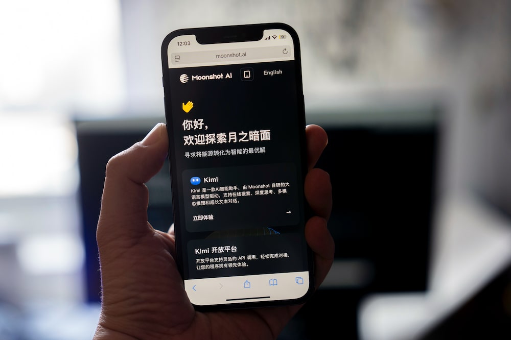 Information for Moonshot AI's Kimi chatbot arranged on a smartphone in Shanghai, China, on Wednesday, Jan. 7, 2026. Chinese firms such as Moonshot have released AI models that approach the capabilities of leading systems from US companies, spurred on by a government that has made AI leadership a national priority. Photographer: Raul Ariano/Bloomberg Information for Moonshot AI's Kimi chatbot arranged on a smartphone in Shanghai, China, on Wednesday, Jan. 7, 2026. Chinese firms such as Moonshot have released AI models that approach the capabilities of leading systems from US companies, spurred on by a government that has made AI leadership a national priority. Photographer: Raul Ariano/Bloomberg