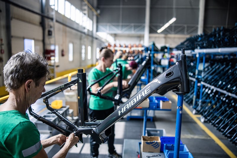 An employee works on a Haibike Trekking bicycle frame on the e-bike assembly line at the Accell Hunland Kft plant in Toszeg, Hungary, on Wednesday, Sept. 7, 2022. Demand surged for e-bikes during the early days of the pandemic as people looked for new ways to travel safely and again this spring as rising fuel prices sent commuters looking for cheaper alternatives. Photographer: Akos Stiller/Bloomberg An employee works on a Haibike Trekking bicycle frame on the e-bike assembly line at the Accell Hunland Kft plant in Toszeg, Hungary, on Wednesday, Sept. 7, 2022. Demand surged for e-bikes during the early days of the pandemic as people looked for new ways to travel safely and again this spring as rising fuel prices sent commuters looking for cheaper alternatives. Photographer: Akos Stiller/Bloomberg