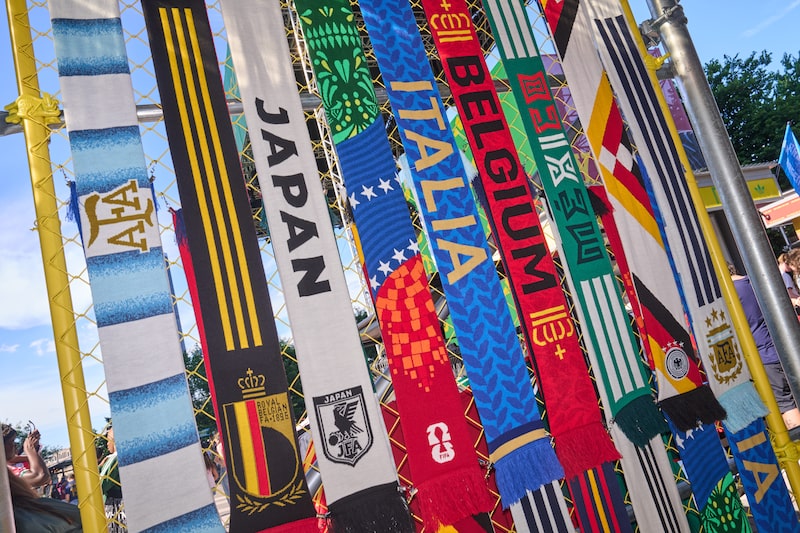 National team scarves for Argentina, Belgium, Japan, Italy, Mexico, and Germany at a FIFA World Cup 2026 watch party hosted by Adidas at Brooklyn Bridge Park in the Brooklyn borough of New York, US, on Tuesday, June 16, 2026. The World Cup is back in the US for the first time since 1994 in its biggest version yet, encompassing 48 teams and 104 matches that are also being played in neighboring Canada and Mexico. Photographer: Bing Guan/Bloomberg National team scarves for Argentina, Belgium, Japan, Italy, Mexico, and Germany at a FIFA World Cup 2026 watch party hosted by Adidas at Brooklyn Bridge Park in the Brooklyn borough of New York, US, on Tuesday, June 16, 2026. The World Cup is back in the US for the first time since 1994 in its biggest version yet, encompassing 48 teams and 104 matches that are also being played in neighboring Canada and Mexico. Photographer: Bing Guan/Bloomberg