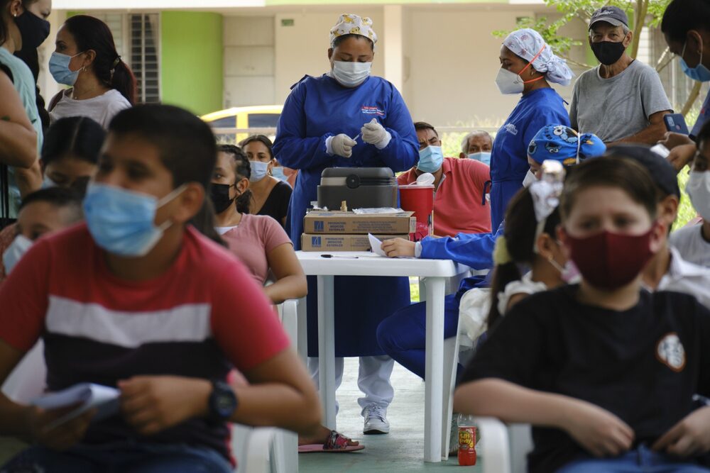 A healthcare worker prepares a dose of the AstraZeneca Covid-19 vaccine during a vaccination event for Venezuelan migrants near the Venezuelan border in Cucuta, Colombia, on Wednesday, Nov. 3, 2021. Venezuelas President Nicolas Maduro said that 67% of Venezuelans have been vaccinated against coronavirus, without specifying whether he was referring to one or two doses, and lifted quarantine restrictions for the whole country for the months of November and December. Photographer: Ferley Ospina/Bloomberg A healthcare worker prepares a dose of the AstraZeneca Covid-19 vaccine during a vaccination event for Venezuelan migrants near the Venezuelan border in Cucuta, Colombia, on Wednesday, Nov. 3, 2021. Venezuelas President Nicolas Maduro said that 67% of Venezuelans have been vaccinated against coronavirus, without specifying whether he was referring to one or two doses, and lifted quarantine restrictions for the whole country for the months of November and December. Photographer: Ferley Ospina/Bloomberg