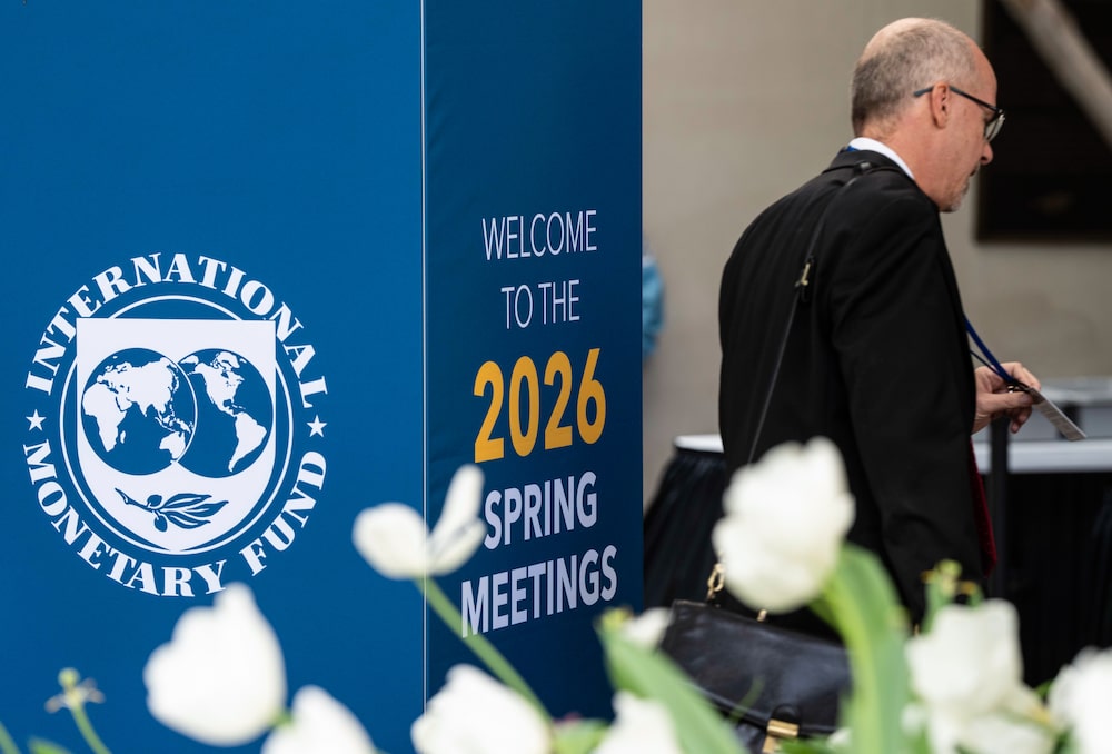 An attendee arrives for the 2026 Spring Meetings of the International Monetary Fund and the World Bank Group in Washington, DC, April 13, 2026. An attendee arrives for the 2026 Spring Meetings of the International Monetary Fund and the World Bank Group in Washington, DC, April 13, 2026.