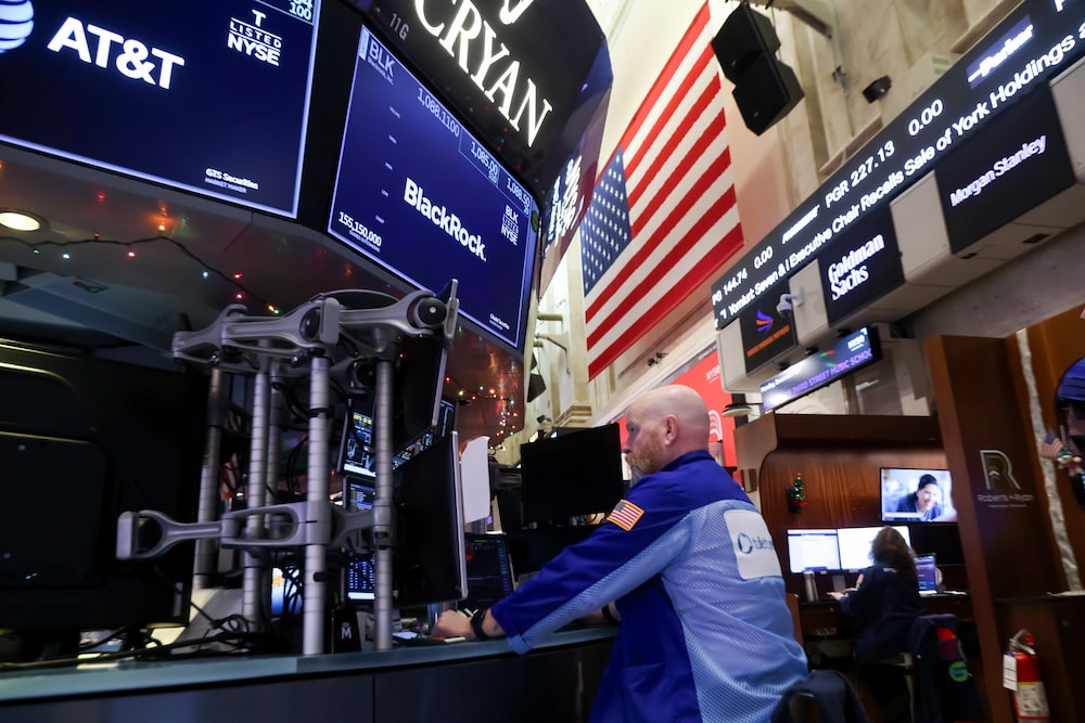 Traders work on the floor of the New York Stock Exchange. Traders work on the floor of the New York Stock Exchange.