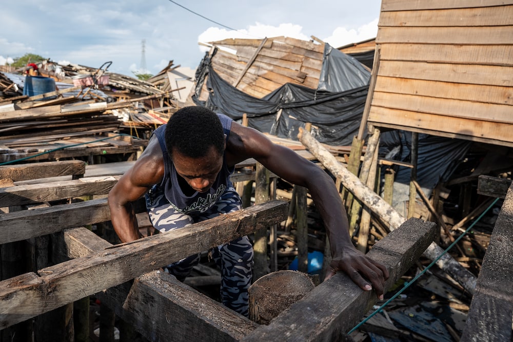A person helps to rebuild a house destroyed by the August 10th earthquake in Buenaventura, Valle del Cauca, Colombia, on Monday, Aug. 24, 2026. Colombia declared a 30-day economic emergency to tackle the fallout from a devastating earthquake, adding new spending pressures as the country grapples with one of the most fragile fiscal outlooks in its history. Photographer: Jair F. Coll/Bloomberg A person helps to rebuild a house destroyed by the August 10th earthquake in Buenaventura, Valle del Cauca, Colombia, on Monday, Aug. 24, 2026. Colombia declared a 30-day economic emergency to tackle the fallout from a devastating earthquake, adding new spending pressures as the country grapples with one of the most fragile fiscal outlooks in its history. Photographer: Jair F. Coll/Bloomberg