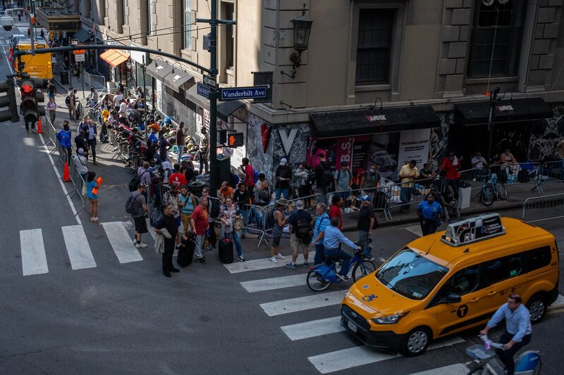 NEW YORK, NEW YORK - AUGUST 02: Migrants gather outside of the Roosevelt Hotel where dozens of recently arrived migrants have been camping out as they try to secure temporary housing on August 02, 2023 in New York City. The migrants, many from Central America and Africa, have been sleeping on the streets or at other shelters as the city continues to struggle with the influx of migrants whose numbers have surged this spring and summer. (Photo by Alexi Rosenfeld/Getty Images) NEW YORK, NEW YORK - AUGUST 02: Migrants gather outside of the Roosevelt Hotel where dozens of recently arrived migrants have been camping out as they try to secure temporary housing on August 02, 2023 in New York City. The migrants, many from Central America and Africa, have been sleeping on the streets or at other shelters as the city continues to struggle with the influx of migrants whose numbers have surged this spring and summer. (Photo by Alexi Rosenfeld/Getty Images)