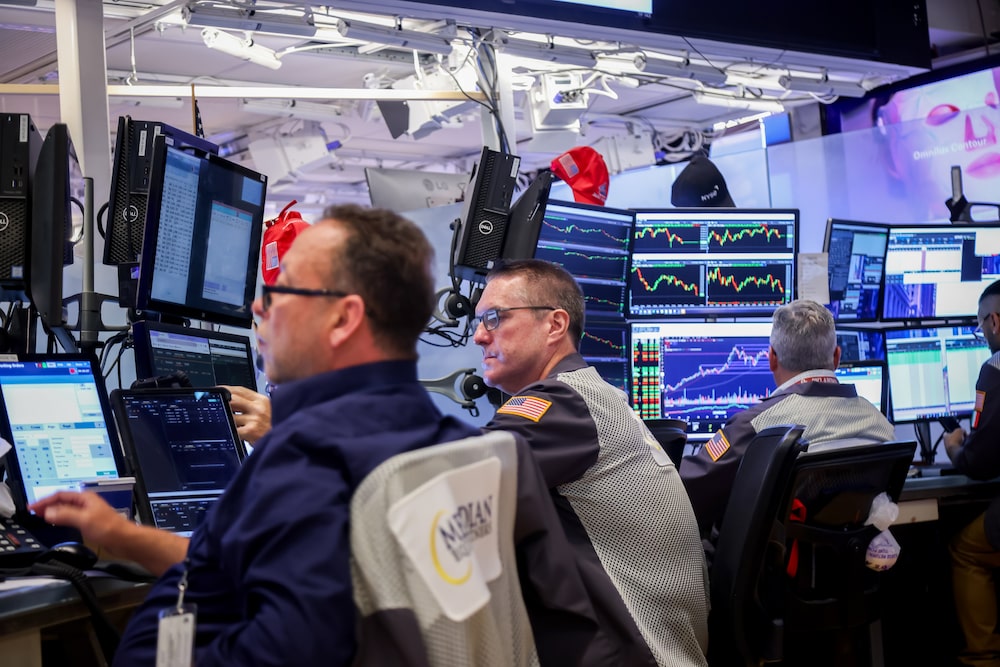 Traders work on the floor of the New York Stock Exchange (NYSE) in New York, US, on Monday, July 14, 2025. US stocks extended declines Monday to fall further from records, as President Donald Trump's latest salvo of tariff threats for Europe and Mexico kept investors on edge as corporate earnings season kicks off this week. Photographer: Michael Nagle/Bloomberg Traders work on the floor of the New York Stock Exchange (NYSE) in New York, US, on Monday, July 14, 2025. US stocks extended declines Monday to fall further from records, as President Donald Trump's latest salvo of tariff threats for Europe and Mexico kept investors on edge as corporate earnings season kicks off this week. Photographer: Michael Nagle/Bloomberg