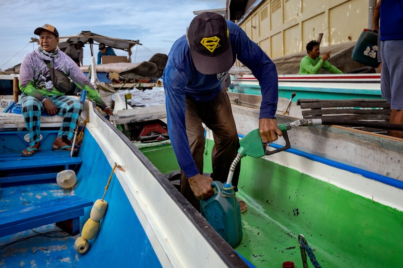 Fishermen buy fuel at a riverside gas station in Hagonoy, Bulacan province, Philippines, on March 9. Photographer: Ezra Acayan/Getty Images Fishermen buy fuel at a riverside gas station in Hagonoy, Bulacan province, Philippines, on March 9. Photographer: Ezra Acayan/Getty Images