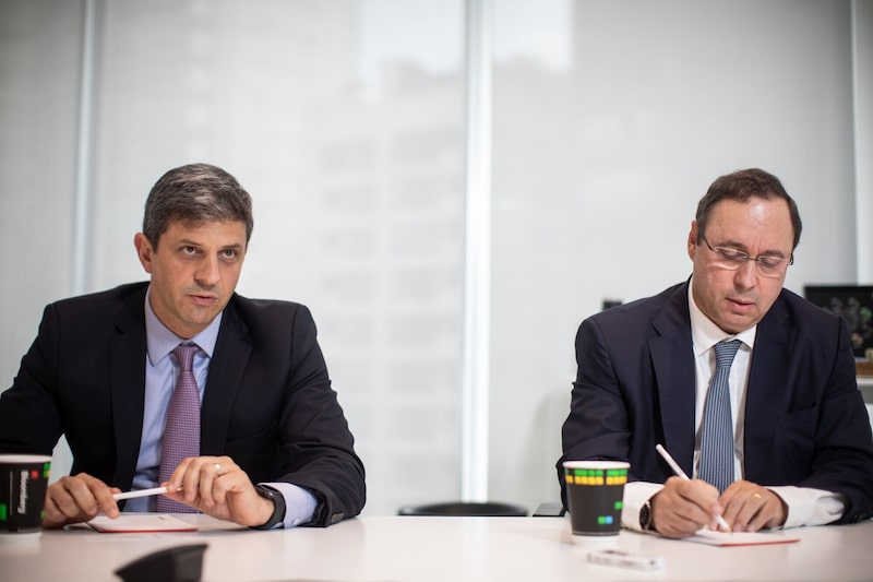 Adriano Sartori, vice president of CBRE Consultoria Do Brasil, speaks while Walter Cardoso, president of CBRE Consultoria Do Brasil, right, listens during an interview in Sao Paulo, Brazil, on Tuesday, April 23, 2019. CBRE commenced operations in Brazil in 1979, after having identified Brazil as a promising market with a growing demand for real estate consultancy and a high degree of complexity in property transactions. Photographer: Victor Moriyama/Bloomberg Adriano Sartori, vice president of CBRE Consultoria Do Brasil, speaks while Walter Cardoso, president of CBRE Consultoria Do Brasil, right, listens during an interview in Sao Paulo, Brazil, on Tuesday, April 23, 2019. CBRE commenced operations in Brazil in 1979, after having identified Brazil as a promising market with a growing demand for real estate consultancy and a high degree of complexity in property transactions. Photographer: Victor Moriyama/Bloomberg