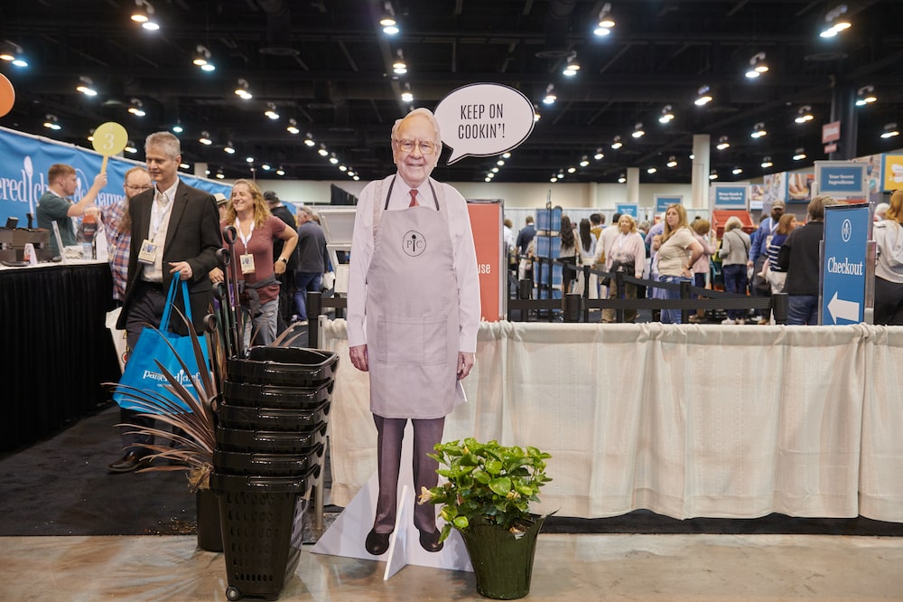 A cutout depicting former Berkshire Hathaway CEO Warren Buffett outside the Pampered Chef booth inside the convention hall during a shareholders shopping day ahead of the Berkshire Hathaway annual shareholders meeting in Omaha, Nebraska, US, on Friday, May 1, 2026. CEO Greg Abel has pledged to follow Buffett's approach to investing and managing risk - Saturday's meeting is branded with the slogan "The Legacy Continues." Photographer: Dan Brouillette/Bloomberg A cutout depicting former Berkshire Hathaway CEO Warren Buffett outside the Pampered Chef booth inside the convention hall during a shareholders shopping day ahead of the Berkshire Hathaway annual shareholders meeting in Omaha, Nebraska, US, on Friday, May 1, 2026. CEO Greg Abel has pledged to follow Buffett's approach to investing and managing risk - Saturday's meeting is branded with the slogan "The Legacy Continues." Photographer: Dan Brouillette/Bloomberg