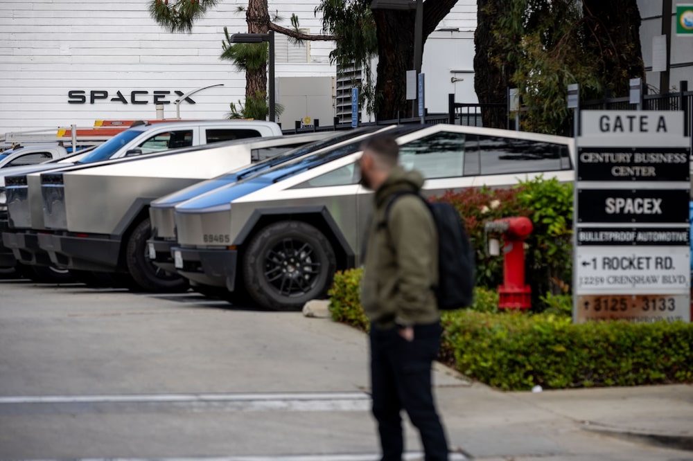 Tesla Cybertrucks parked outside SpaceX facilities in Hawthorne, California, US, on Monday, April 13, 2026. SpaceX has filed confidentially for an initial public offering, according to people familiar with the matter, bringing billionaire Elon Musk's rocket, satellite and AI company closer to delivering the biggest-ever listing. Photographer: Ethan Swope/Bloomberg Tesla Cybertrucks parked outside SpaceX facilities in Hawthorne, California, US, on Monday, April 13, 2026. SpaceX has filed confidentially for an initial public offering, according to people familiar with the matter, bringing billionaire Elon Musk's rocket, satellite and AI company closer to delivering the biggest-ever listing. Photographer: Ethan Swope/Bloomberg