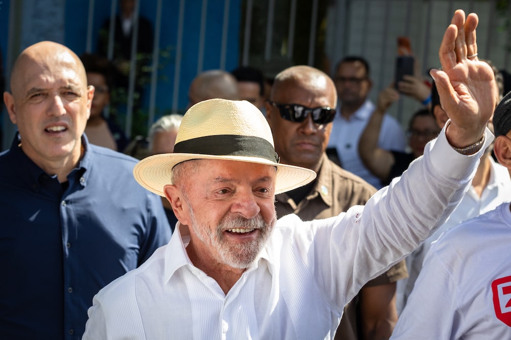 Luiz Inacio Lula da Silva, Brazil's president, center, greets supporters after casting a ballot at a polling station during the general election in Sao Paulo, Brazil, on Sunday, Oct. 4, 2026. Brazilians are headed to the polls Sunday in a tightly contested first round vote between an incumbent that is seeking a fourth term and the eldest son of former President Jair Bolsonaro. Photographer: Maira Erlich/Bloomberg Luiz Inacio Lula da Silva, Brazil's president, center, greets supporters after casting a ballot at a polling station during the general election in Sao Paulo, Brazil, on Sunday, Oct. 4, 2026. Brazilians are headed to the polls Sunday in a tightly contested first round vote between an incumbent that is seeking a fourth term and the eldest son of former President Jair Bolsonaro. Photographer: Maira Erlich/Bloomberg