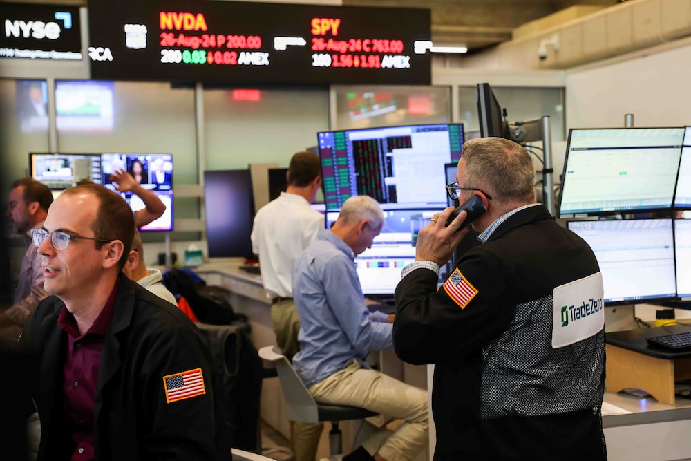 Traders work on the floor of the American Stock Exchange (AMEX) at the New York Stock Exchange (NYSE) in New York, US, on Monday, Aug. 24, 2026. Wall Street kicked off the week on a cautious note, with a rout in chipmakers outweighing an oil decline as traders parsed Treasury Secretary Scott Bessents plan to isolate Iran from the global economy. Photographer: Michael Nagle/Bloomberg Traders work on the floor of the American Stock Exchange (AMEX) at the New York Stock Exchange (NYSE) in New York, US, on Monday, Aug. 24, 2026. Wall Street kicked off the week on a cautious note, with a rout in chipmakers outweighing an oil decline as traders parsed Treasury Secretary Scott Bessents plan to isolate Iran from the global economy. Photographer: Michael Nagle/Bloomberg