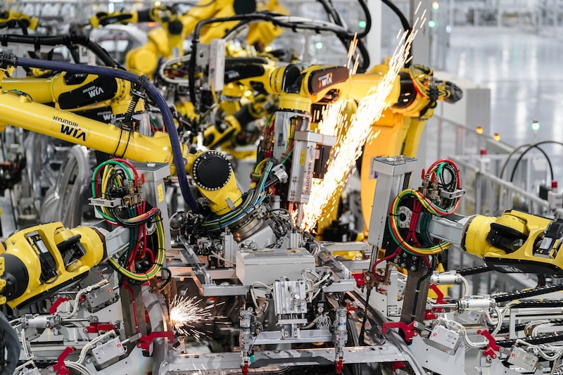 Robotic arms weld roofs onto automobile frames at the Hyundai Metaplant in Ellabell, Georgia, U.S., on Wednesday, June 11, 2025. Photographer: Elijah Nouvelage/Bloomberg Robotic arms weld roofs onto automobile frames at the Hyundai Metaplant in Ellabell, Georgia, U.S., on Wednesday, June 11, 2025. Photographer: Elijah Nouvelage/Bloomberg