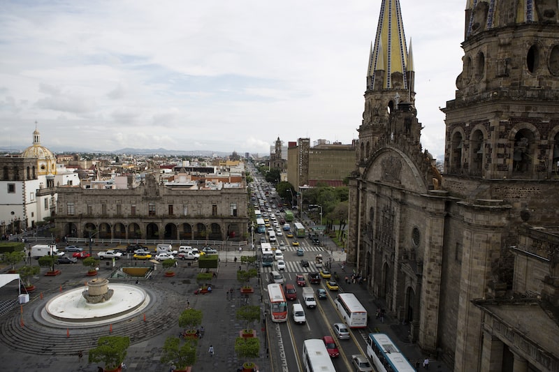 Traffic moves along a street near the Guadalajara Cathedral in Guadalajara, Mexico, on Friday, June 20, 2014. Mexico's record air travel and an airline price war has increased traffic at the Guadalajara International Airport, boosting the local economy of the country's second largest city. Photographer: Susana Gonzalez/Bloomberg Traffic moves along a street near the Guadalajara Cathedral in Guadalajara, Mexico, on Friday, June 20, 2014. Mexico's record air travel and an airline price war has increased traffic at the Guadalajara International Airport, boosting the local economy of the country's second largest city. Photographer: Susana Gonzalez/Bloomberg