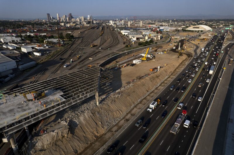 Vehicles travel along Interstate 70 past a construction site for the Central 70 project in Denver, Colorado, U.S., on Thursday, July 15, 2021. Vehicles travel along Interstate 70 past a construction site for the Central 70 project in Denver, Colorado, U.S., on Thursday, July 15, 2021.