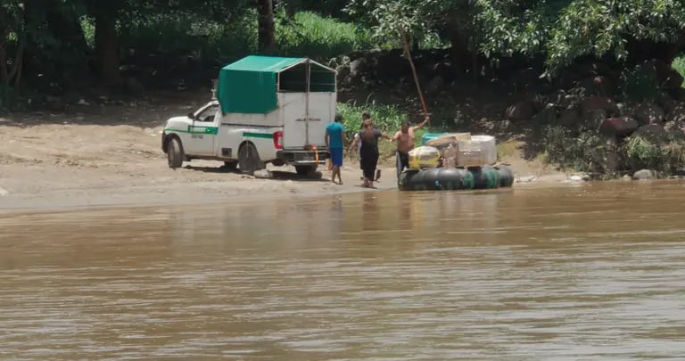 Vehicular crossings in the shallower stretches of the Suchiate River are used to cross people and mecrhandise. dfd