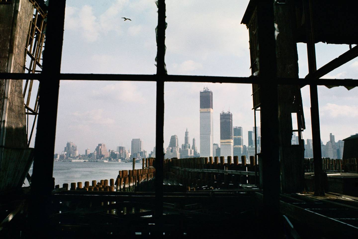 The growing Twin Towers, seen from an abandoned pier in New Jersey, 1970.dfd