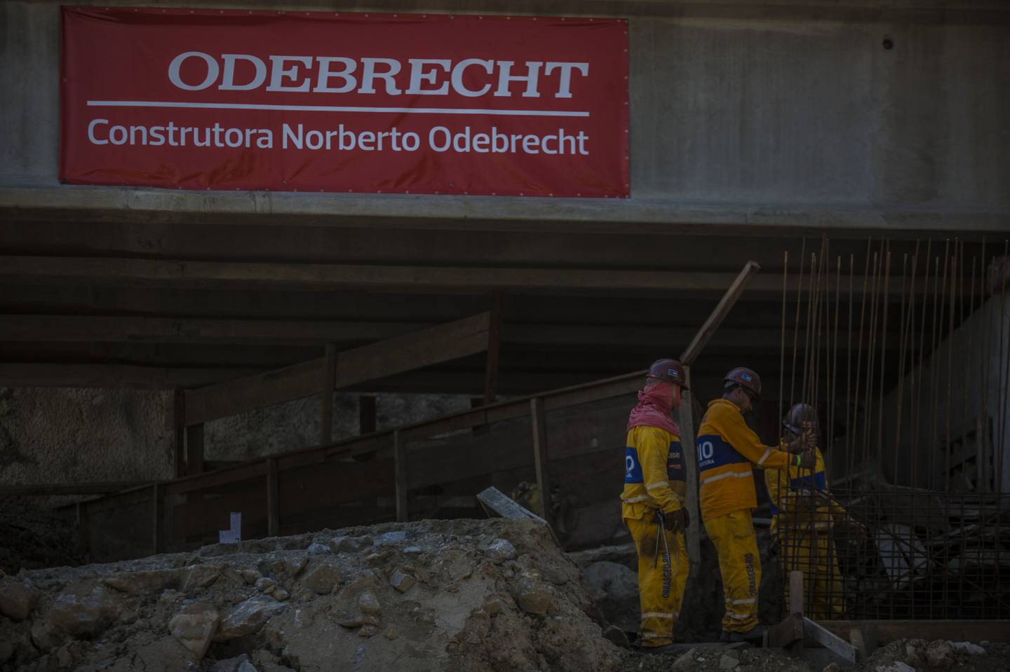 Odebrecht S.A. signage is displayed as contractors work on a construction site in the Barra da Tijuca neighborhood of Rio de Janeiro.