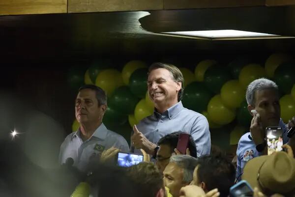 Jair Bolsonaro, presidente de Brasil, centro, durante un evento en Bello Horizonte, Minas Gerais estado de Brasil, el viernes 14 de octubre de 2022. Fotógrafa: Ana Carolina de Lima/Bloomberg