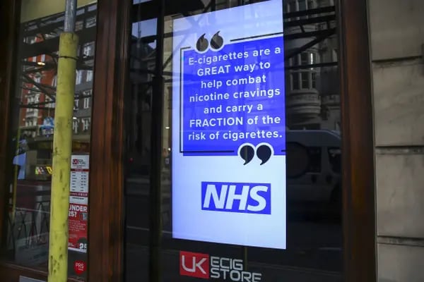 An advisory for e-cigarettes from the state-run National Health Service (MHS) sits in the window of an e-cigarette store in London, U.K., on Wednesday, Oct. 9, 2019.
