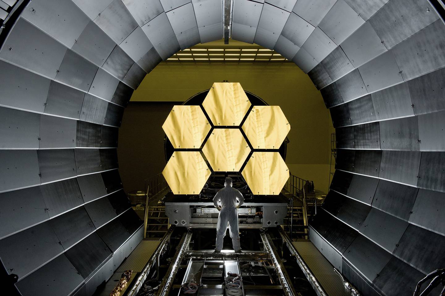 NASA engineer Ernie Wright looks on as the first six flight ready James Webb Space Telescope's primary mirror segments being prepped to begin final cryogenic testing at NASA's Marshall Space Flight Center.