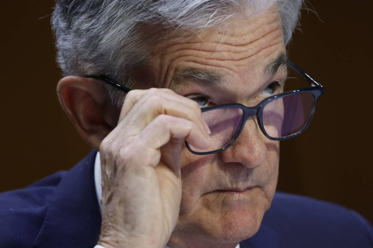 Stocks rallied and Treasury yields fell with the dollar as Jerome Powell said the Federal Reserve will slow the pace of rate increases at one point.