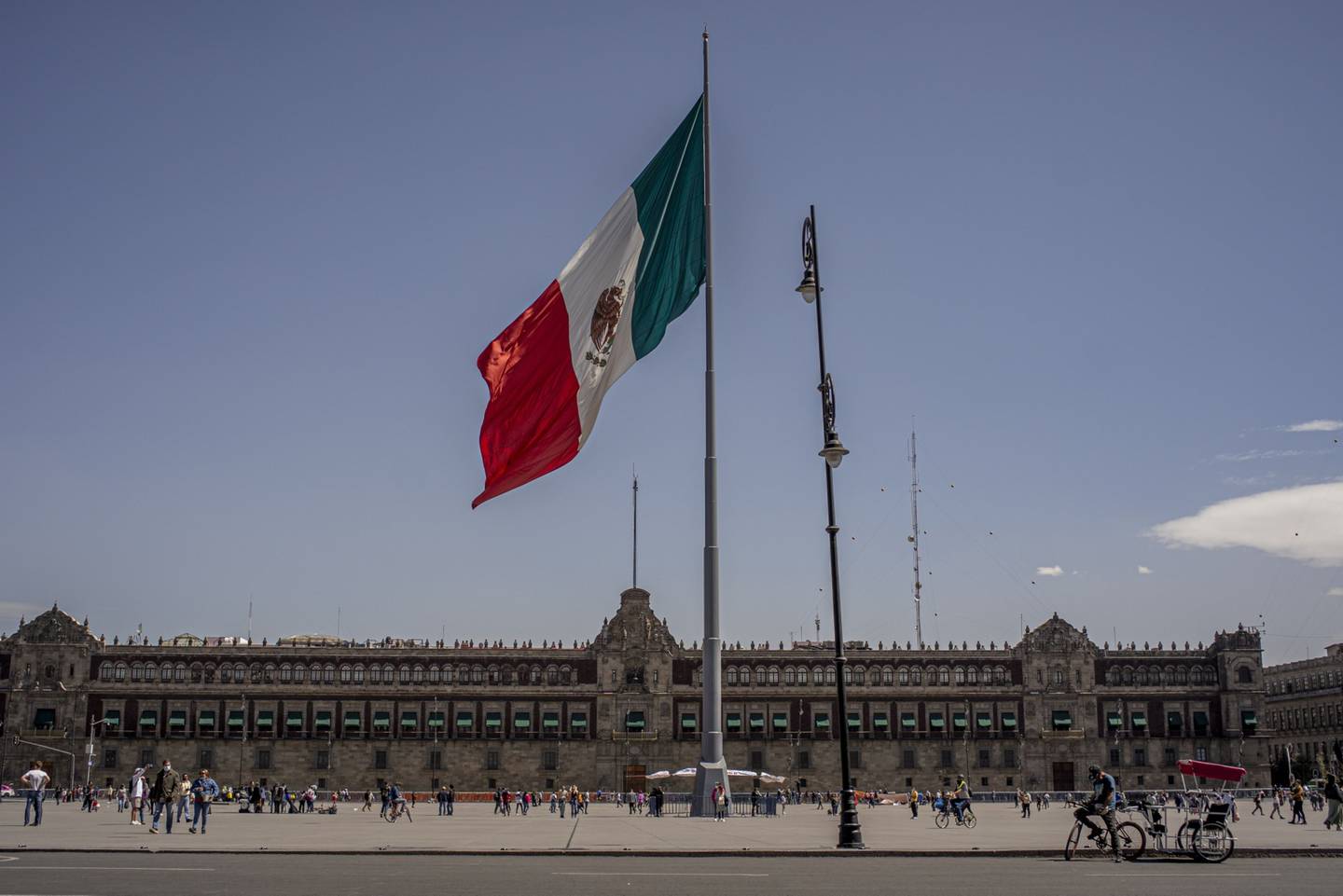 The Mexican flag flies in Plaza de la Constitución, or Zócalo, Mexico City's central square, on February 11, 2022.