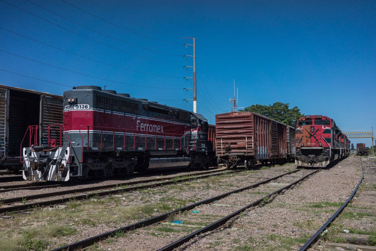 Grupo Mexico Transportes SA Ferrocarril Mexicano (Ferromex) freight trains sit parked at a yard in Tepic, Nayarit State, Mexico.dfd